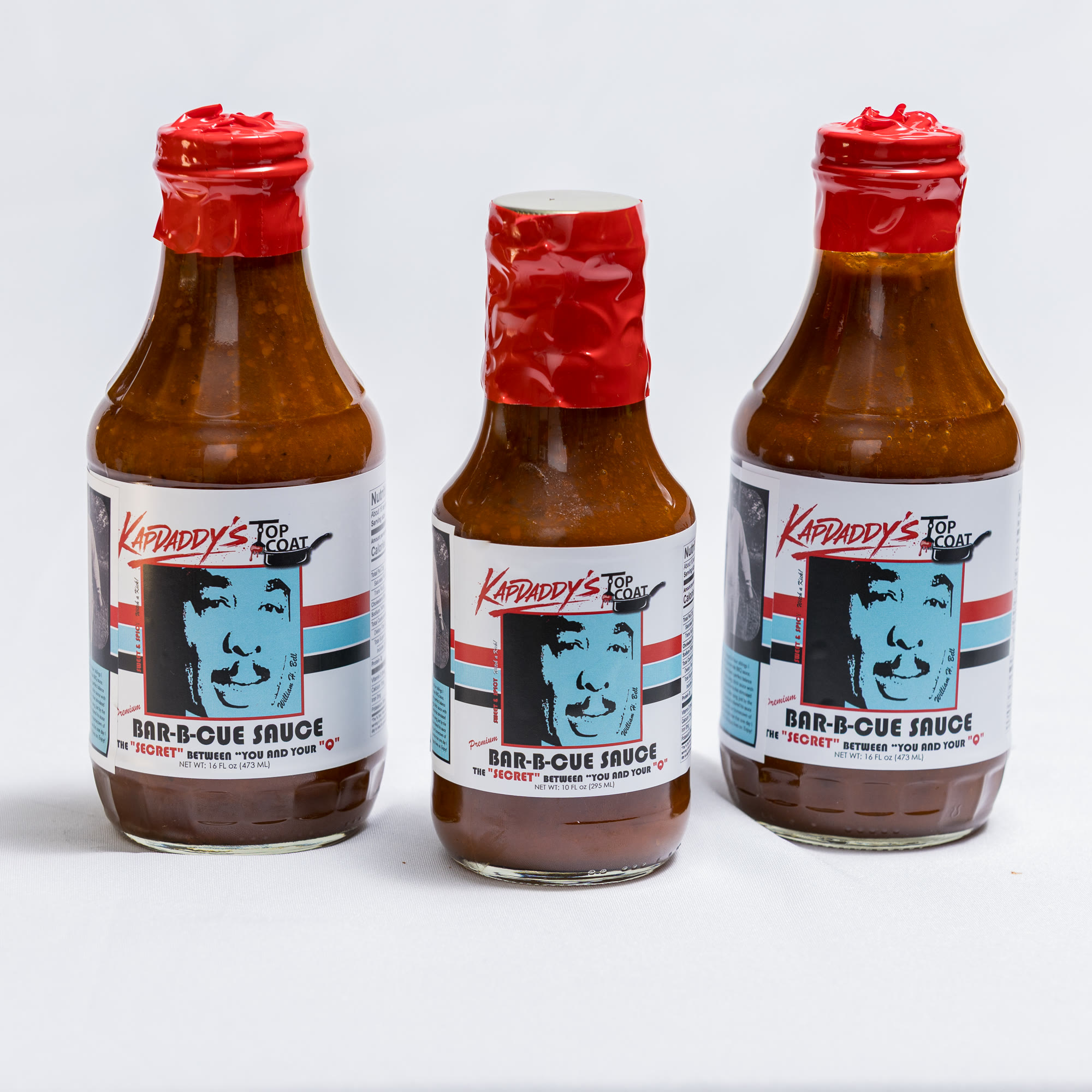 Three bottles of KAPDADDY'S Bar-B-Cue sauce